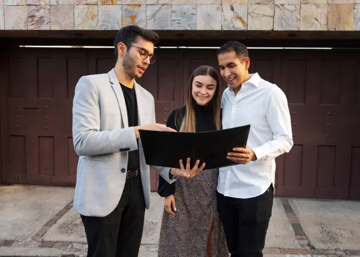 Real estate agents showcasing homes for sale